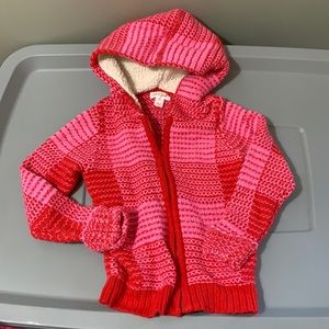 Pink and red zip up sweater